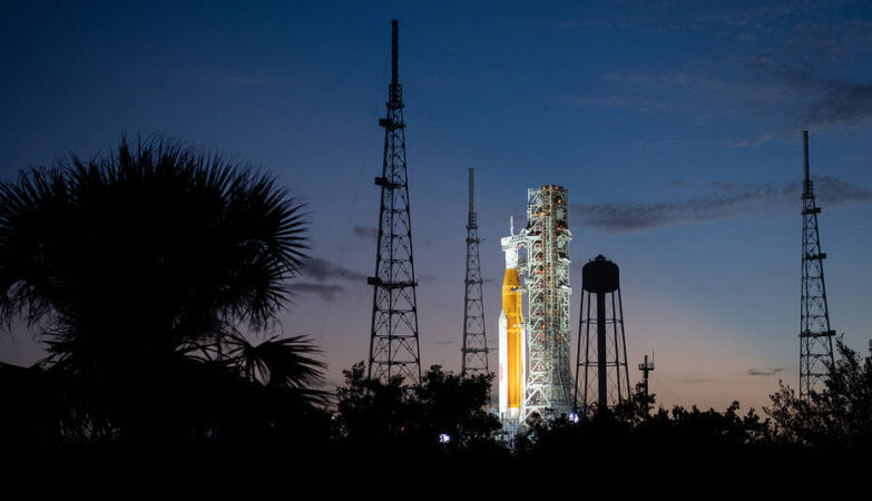 NASA’s Space Launch System (SLS) rocket with the Orion spacecraft aboard is seen illuminated by spotlights after sunset atop the mobile launcher at Launch Pad 39B as preparations for launch continue, Sunday, Nov. 6, 2022, at NASA’s Kennedy Space Center in Florida. NASA’s Artemis I flight test is the first integrated test of the agency’s deep space exploration systems: the Orion spacecraft, SLS rocket, and supporting ground systems. Launch of the uncrewed flight test is targeted for Nov. 14 at 12:07 a.m. EST. Photo Credit: (NASA/Joel Kowsky